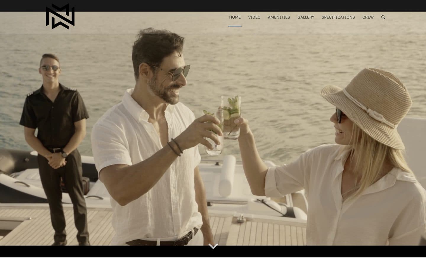 The No Matter What website homepage: guests raising cocktails on the aft deck as a crew member looks on, beneath a menu of Home, Video, Amenities, Gallery, Specifications and Crew